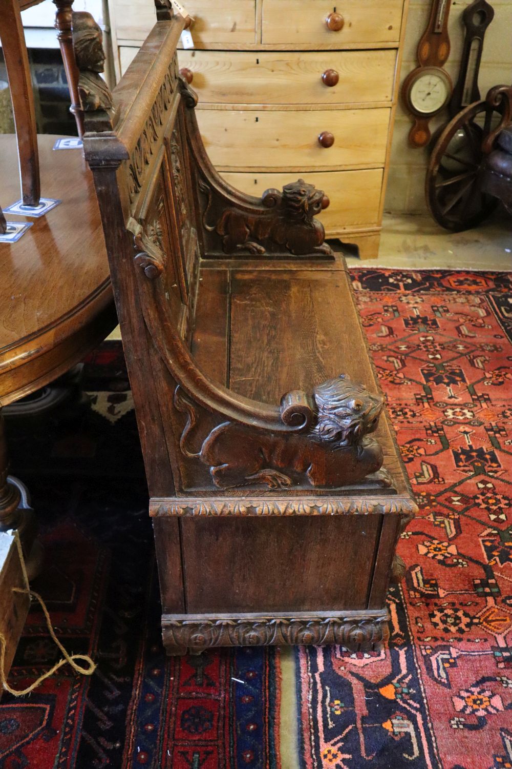 A late 19th century French carved box seat settle, width 100cm, depth 45cm, height 116cm